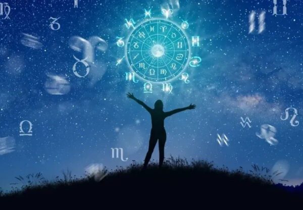 Silhouette beneath zodiac signs and starry sky.