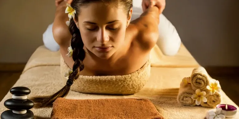 Woman enjoying a relaxing back massage at a spa.