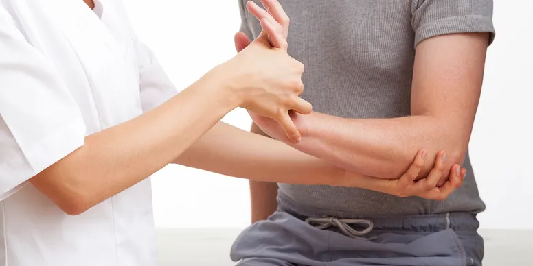 Person receiving a hand massage.