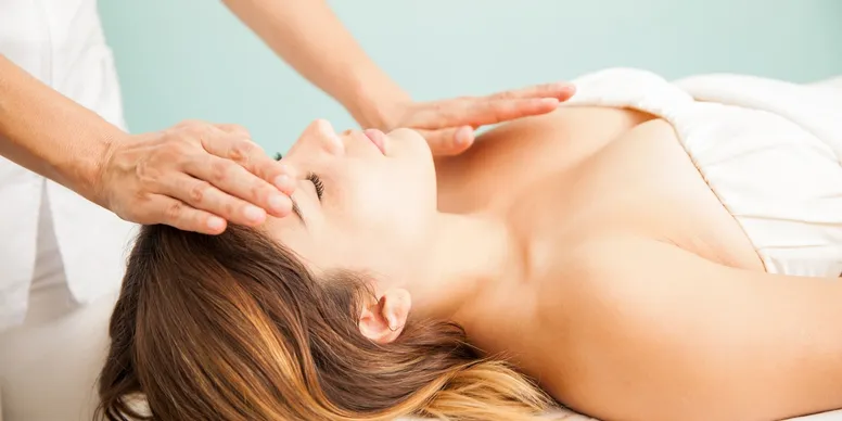 Woman receiving a relaxing head massage.